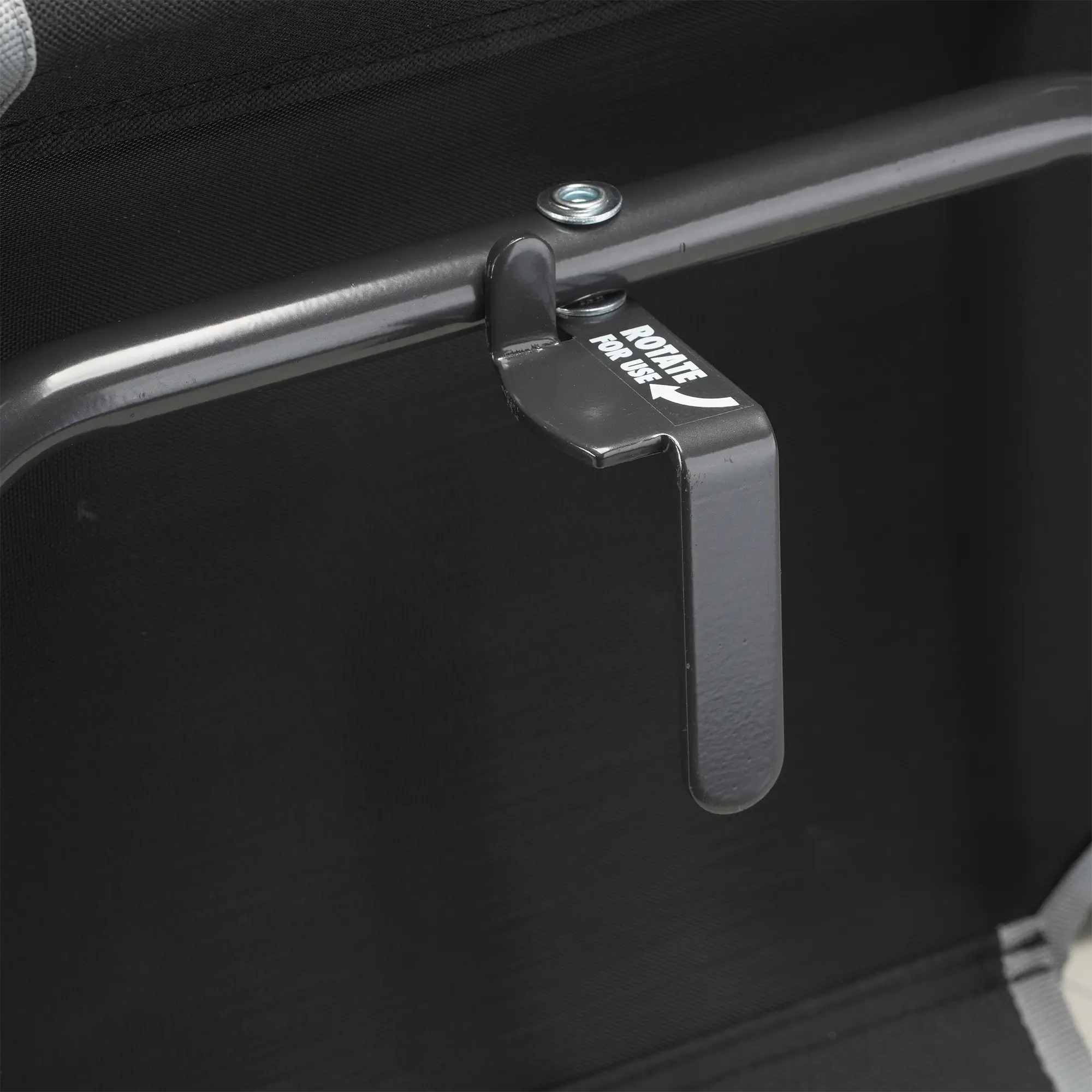 An up-close of the l-hook underneath the black big comfort stadium chair with armrests.