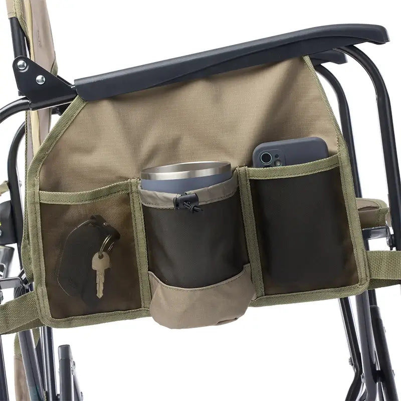 Camping chair with a side drink caddy attached, containing a cup, keys, and a phone.