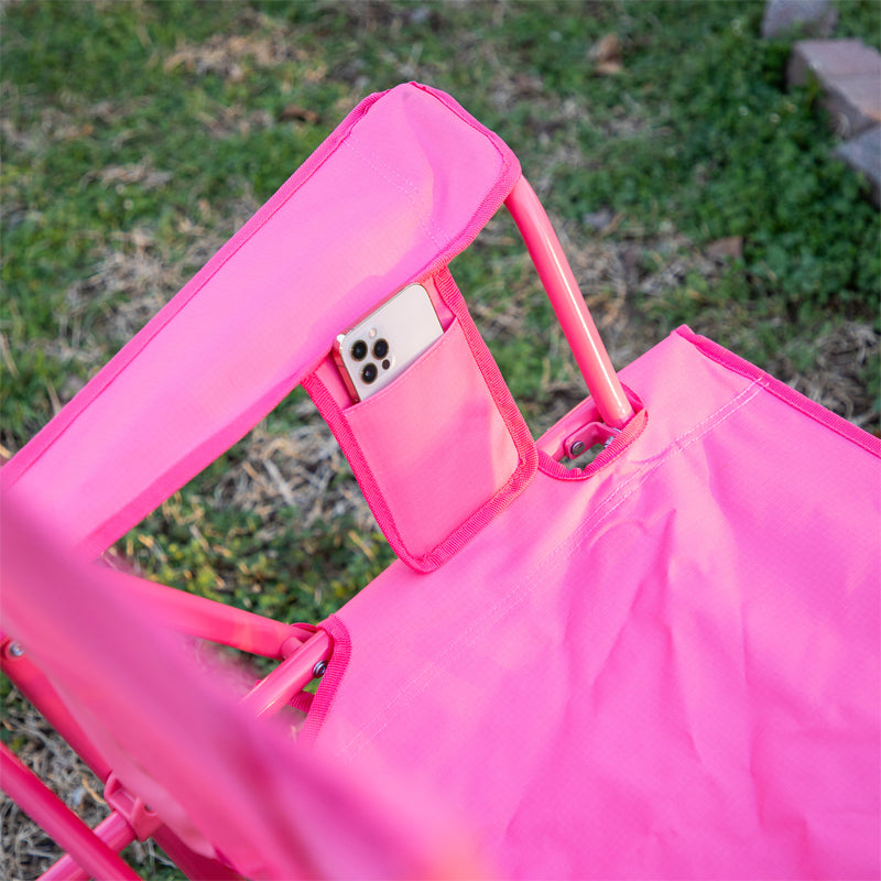 Blush Comfort Pro Rocker armrest with phone pocket holding a smartphone, shown from a top angle.