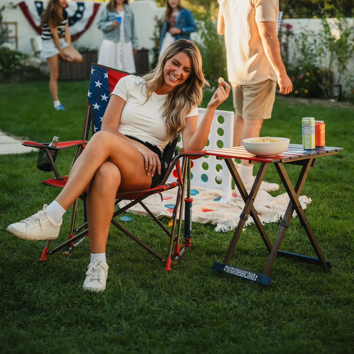 A woman eating chips while sitting in a USA Comfort Pro Rocker.