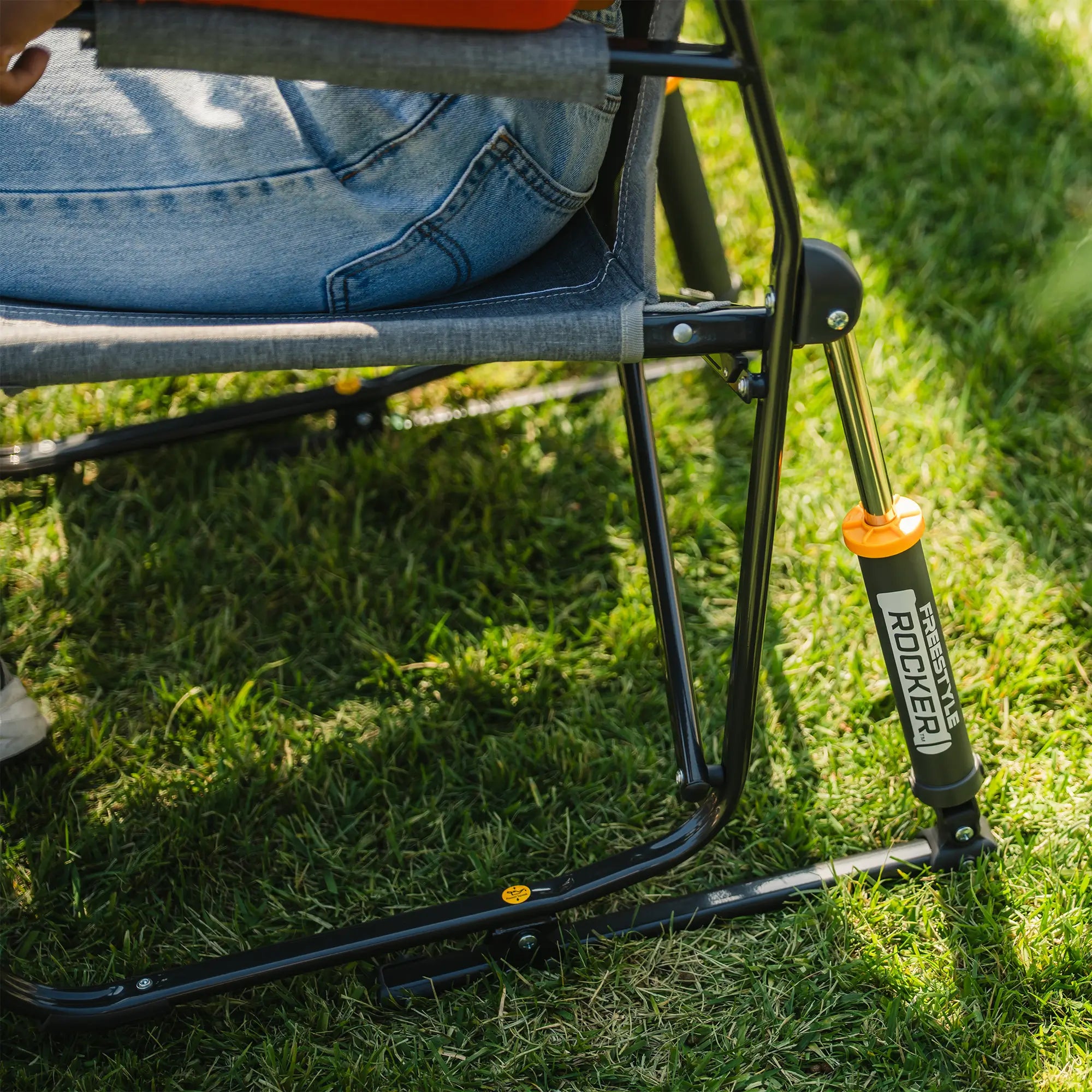 Close-up of the gray freestyle rocker with side table spring action rocking technology.