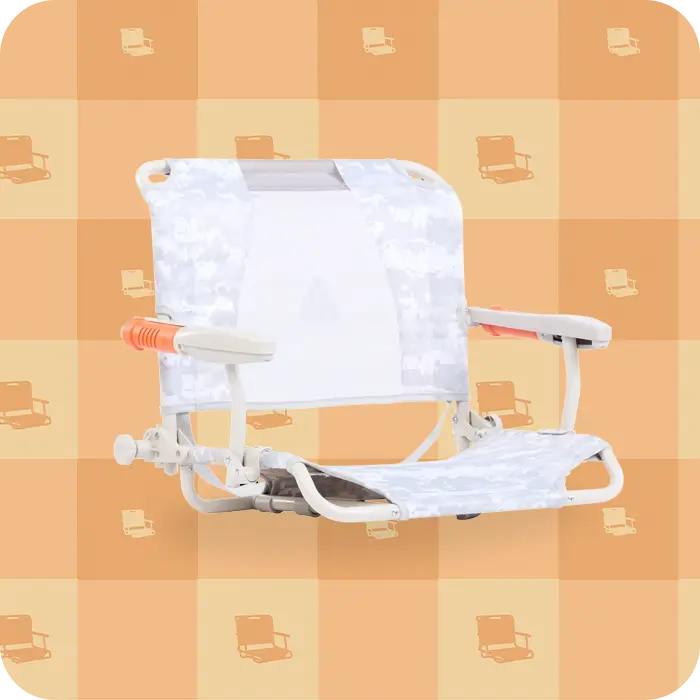 A snow camo stadium rock-cliner with an orange gift wrapper pattern behind it.