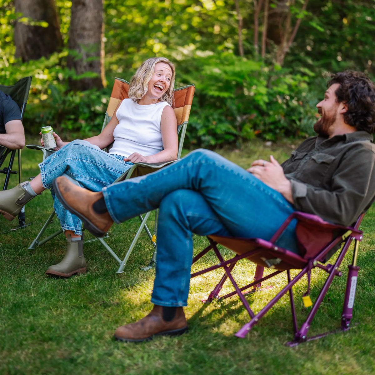 A woman laughing while speaking to a man sitting next to her as they sit in Insulated Comfort Pro Rockers.