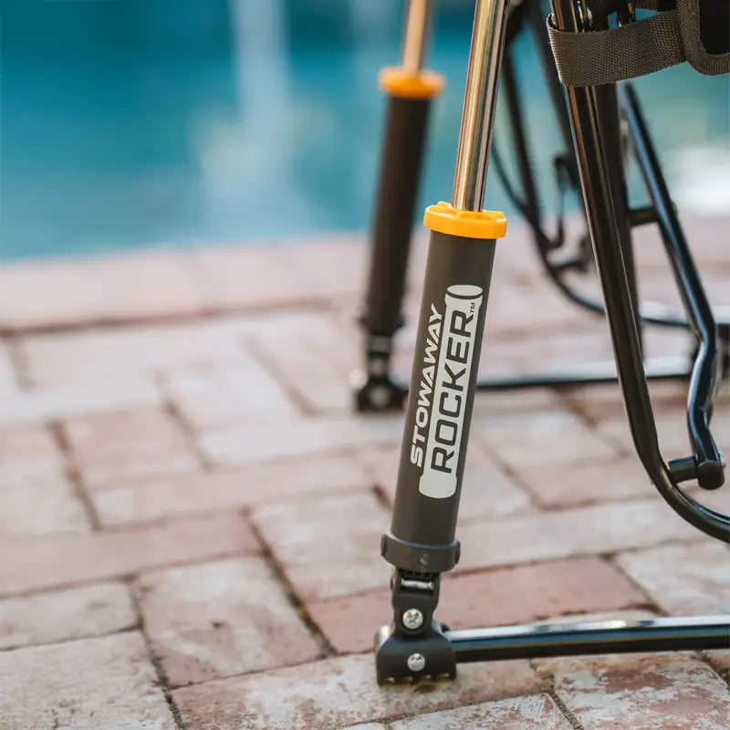 Close-up of the Stowaway Rocker’s spring-action rocker feet with "STOWAWAY ROCKER" branding.