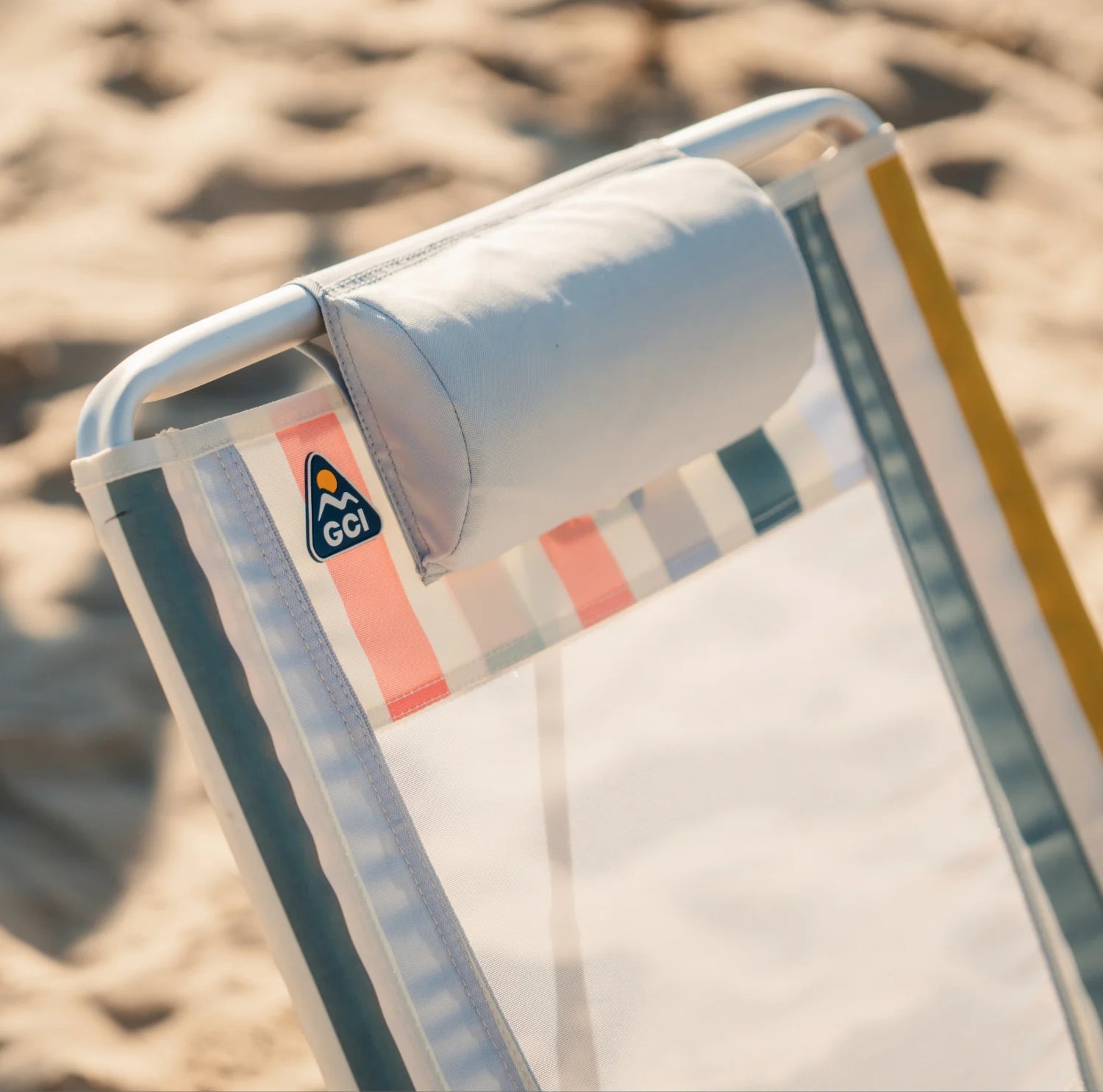 Close-up of the headrest and upper mesh back on a GCI Big Surf chair in retro beach stripes.
