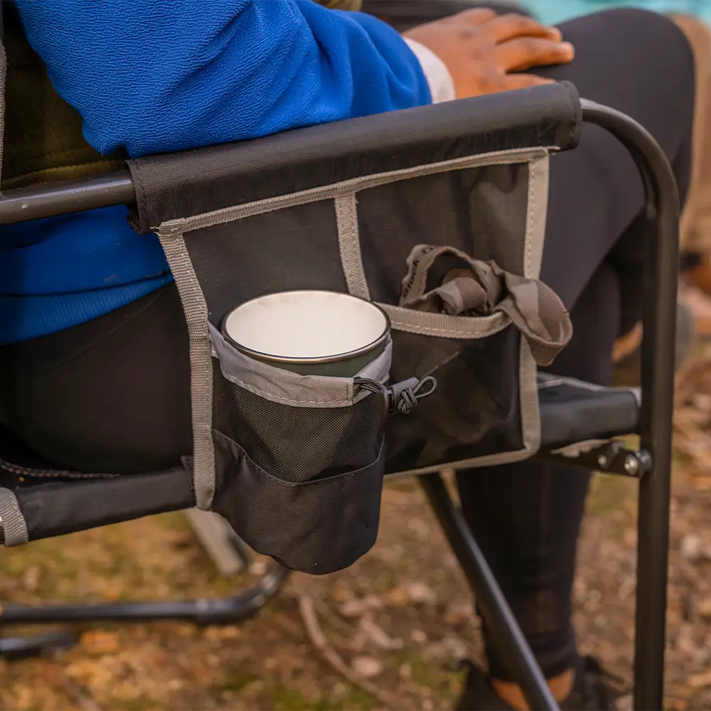 A cup inside the cup holder of a black freestyle rocker xl. 
