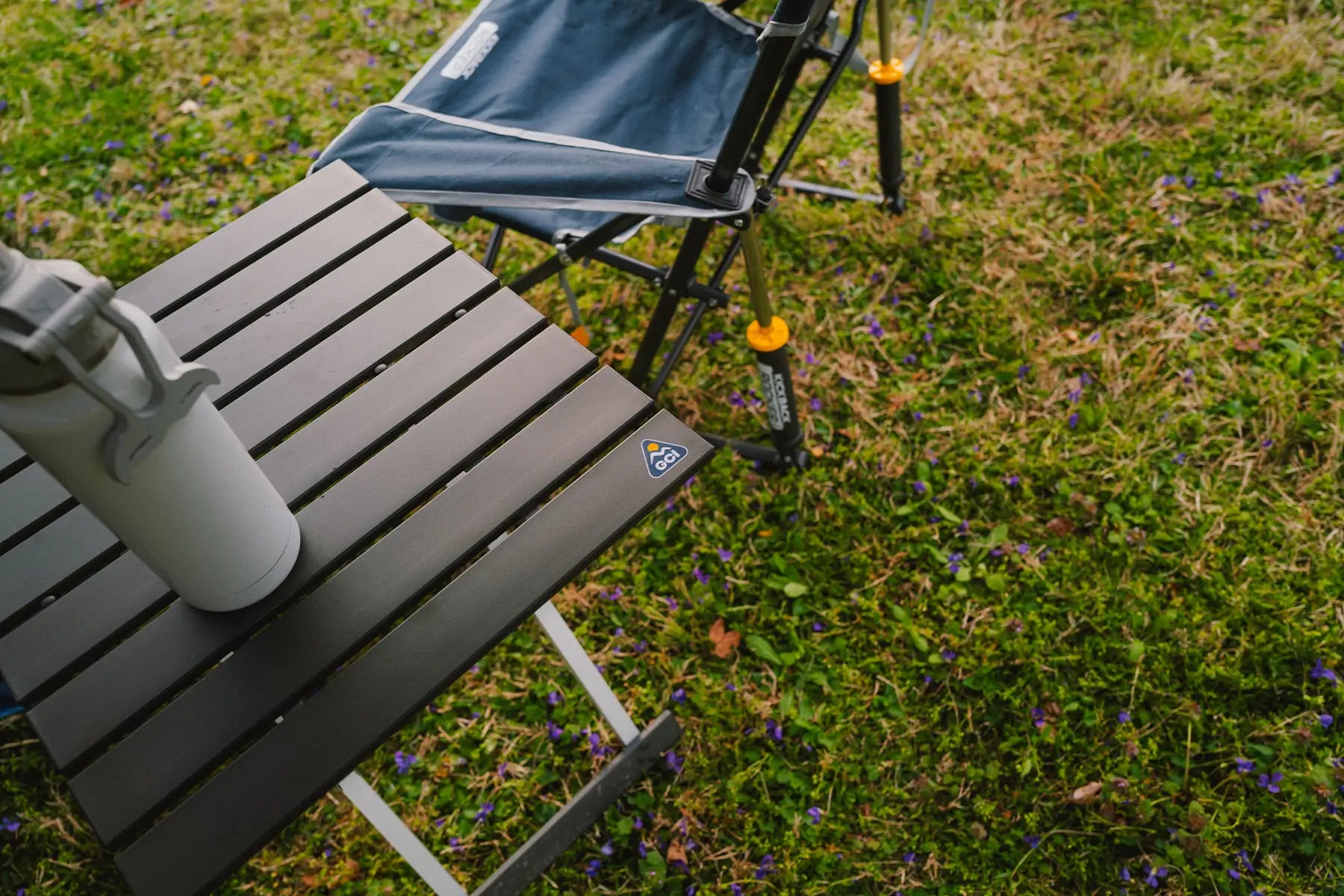 A top view of the Compact Camp Table 20 with a water bottle positioned on the table. 