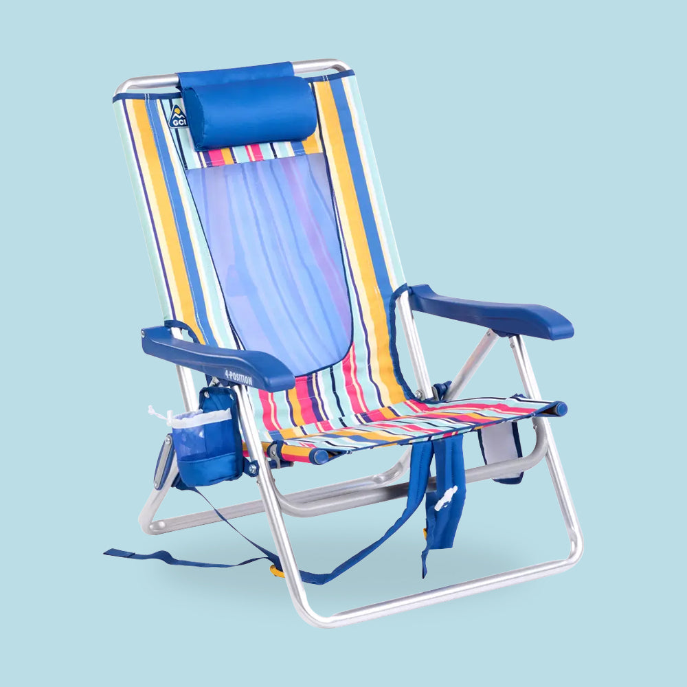 A backpack beach chair in front of a blue background. 