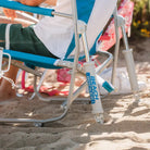 Close-up of Saybrook Blue Beach Rocker on sand, highlighting spring-action rocker mechanism and sturdy frame.