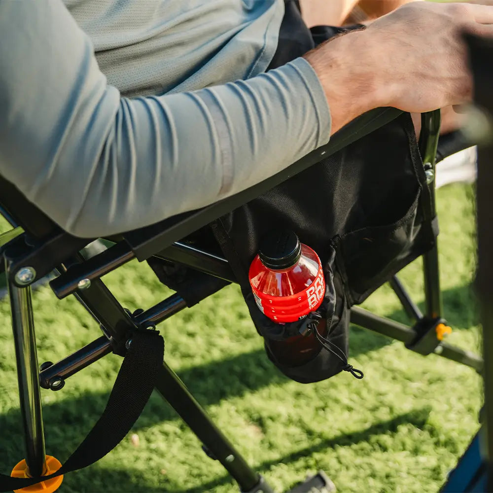 Close-up of a drink bottle stored in the side pocket of the Black Breeze Rocker.