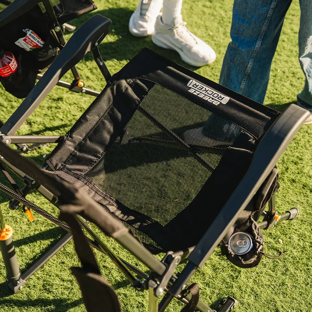 Close-up of the mesh seat pocket on the Black Breeze Rocker holding small personal items.