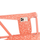 Up-close of the coral garden comfort pro rocker phone holder pocket.