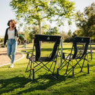 Two Comfort Pro Rocker chairs positioned next to a playground. 