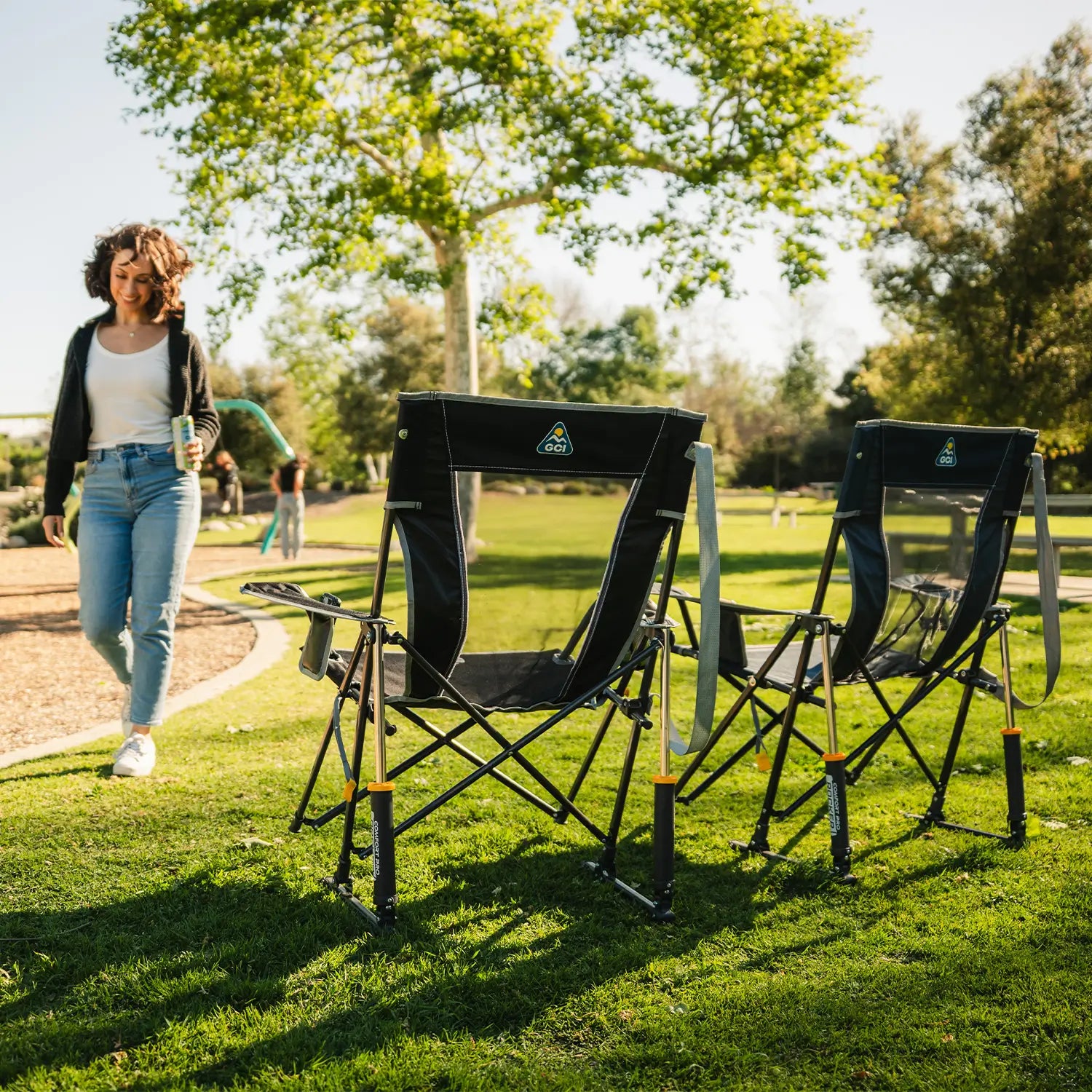Two Comfort Pro Rocker chairs positioned next to a playground. 
