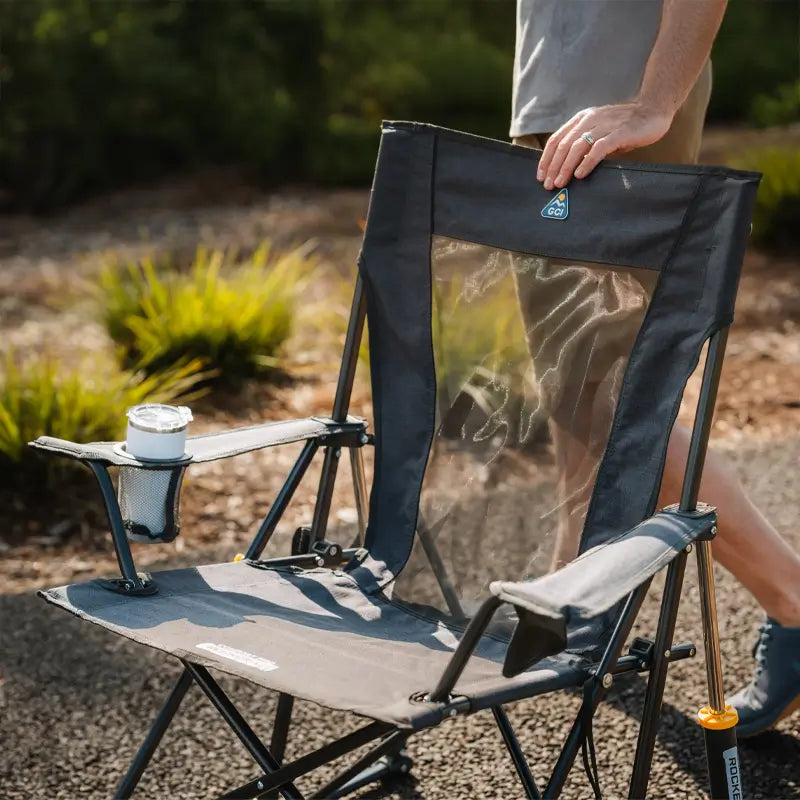 Close-up of the Heathered Charcoal Comfort Pro Rocker XL with a mesh back and drink in the cupholder. all-groups