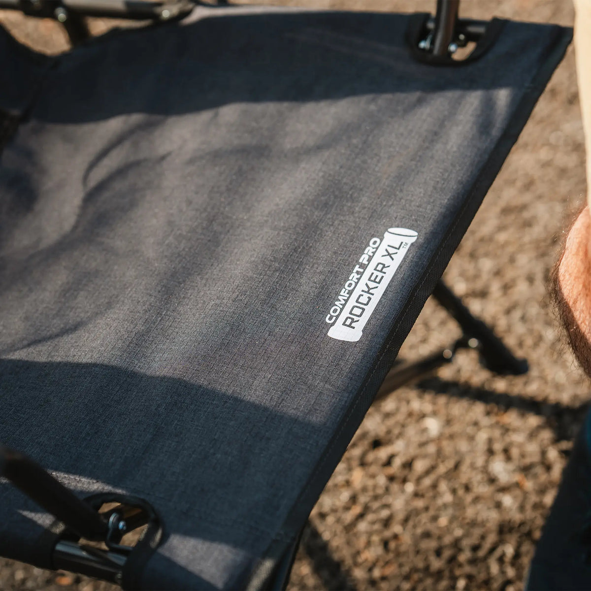 Fabric detail showing the "Comfort Pro Rocker XL" branding on the seat.