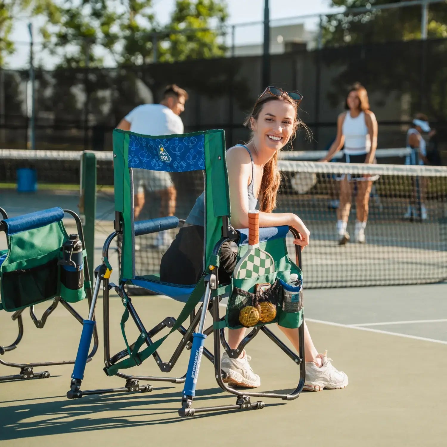 Woman turned around while siting in pickleball stowaway rocker. 