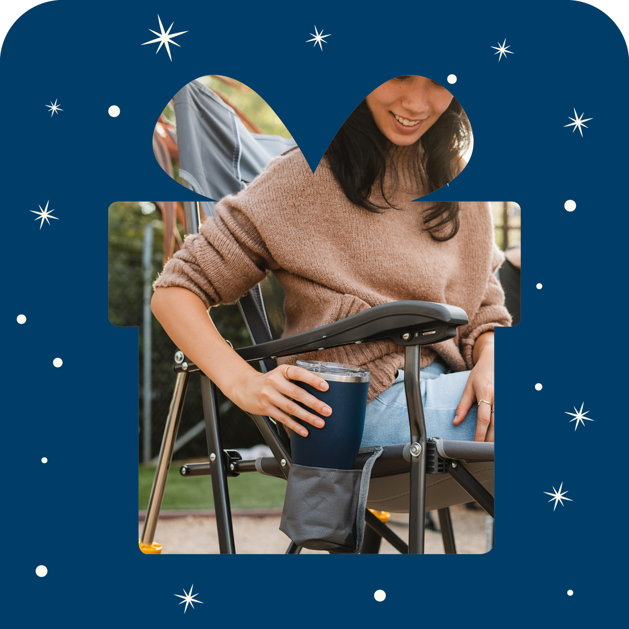 A gift box shaped outline with a roadtrip rocker inside the gift. 