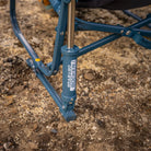 all-groups Close-up of the teal Grab & Go Rocker spring-action technology on campsite ground.