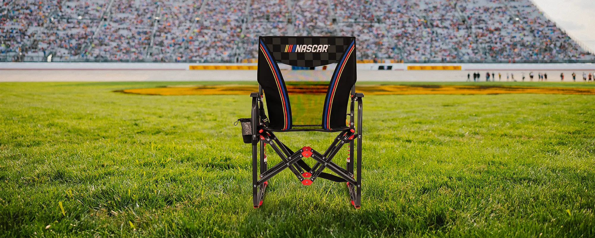 A NASCAR Adjustable Rocker positioned in front of a racetrack. 