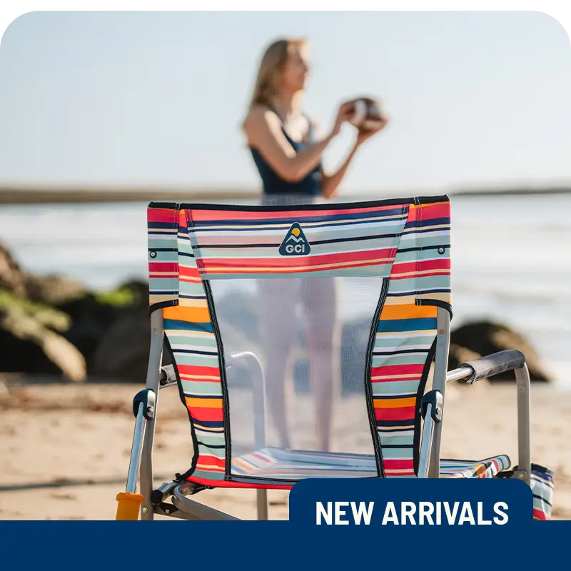 A colorful Beach Rocker chair sits on the sand with a blurred person holding a ball in the background. "New Arrivals" label at the bottom.