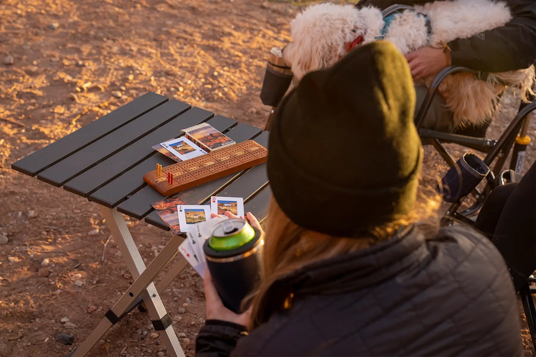 A woman playing cards on a compact camp table 20. 
