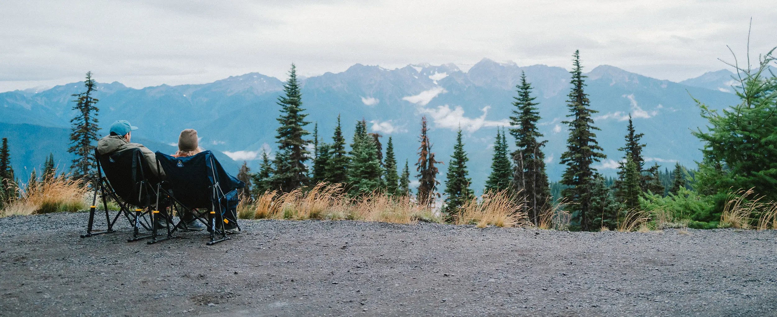 A couple looking at an overlook while sitting in their puff rocker chairs. 