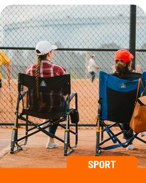 Two people sitting in a freestyle rocker elite and stowaway rocker at a baseball event. 