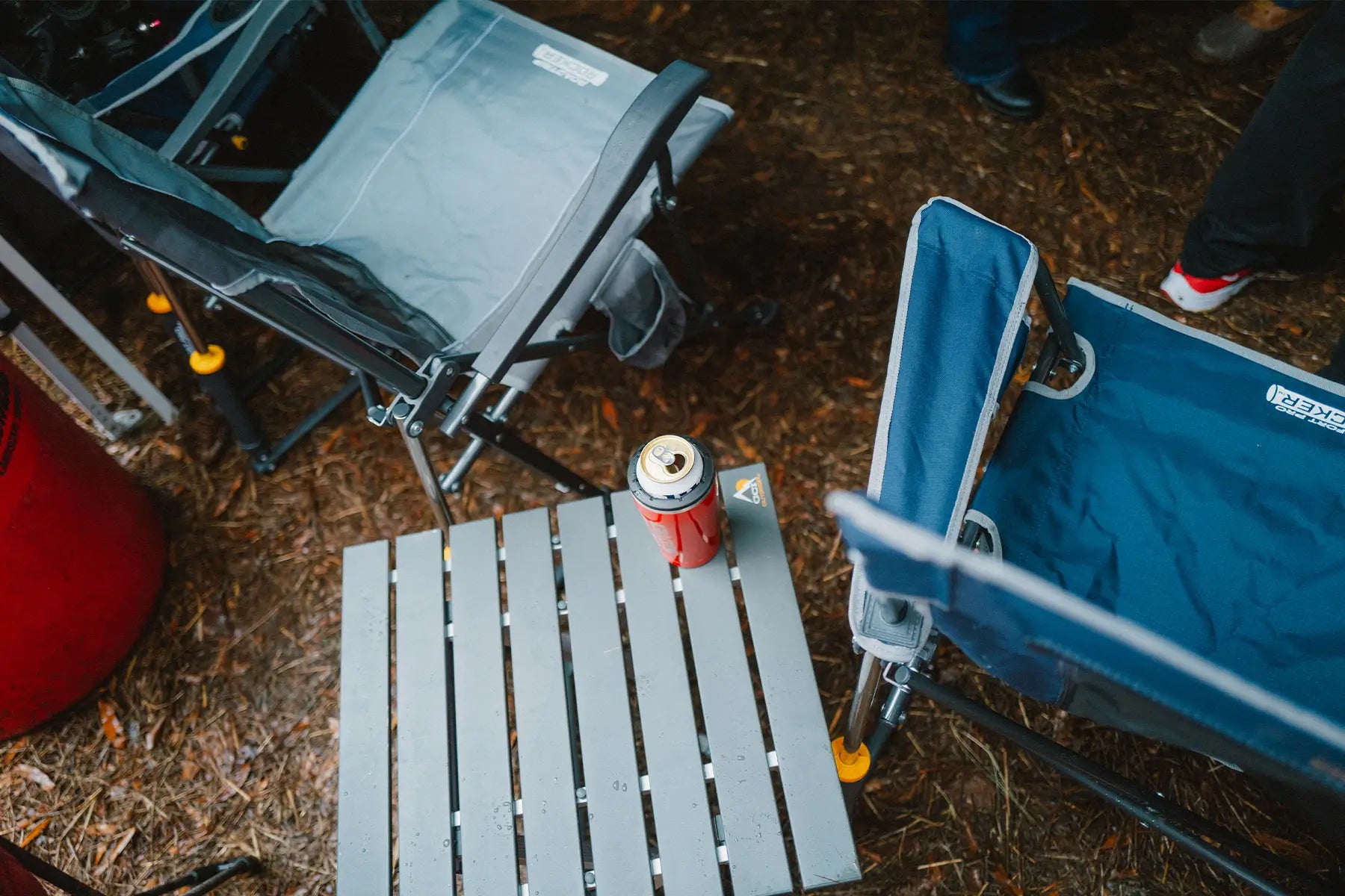 A group of GCI products positioned on a mulch bed next to a group of tailgaters. 