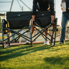 A man folding up the seat on the Tandem Rocker using the eazy-fold technology. 
