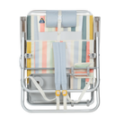 Front angle of the backpack straps on the folded Big Surf with Slide Table in retro beach stripes print.