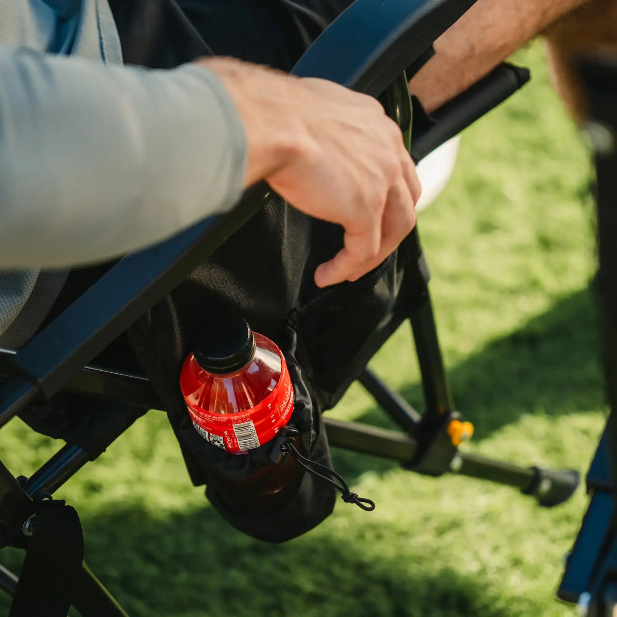 An up close view of the attached cup holder on a black Breeze Rocker. 
