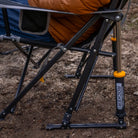 Close-up of the freestyle rocker's spring-action rocking system shocks in an outdoor setting.