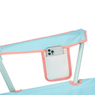 Close-up of the beverage holder on the Comfort Quad Chair in ivory color block.