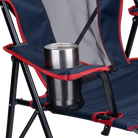 A cup inside the cup holder of the indigo/red Comfort Quad Chair. 