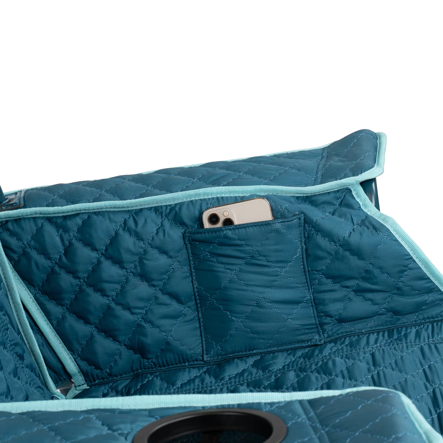 Close up view of the phone holder pocket on the teal Kickback Insulated Rocker.