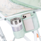 Close-up of the phone pocket and beverage holder on the floral bouquet Pod Rocker.