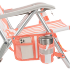 Close-up of the phone pocket and beverage holder on the SideKick lounger in coral stripes.
